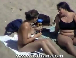 Oral romp on bare beach from spycam camera